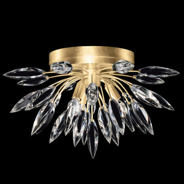 Gold ceiling light fixture with crystal accents on a black background