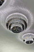 https://cdn.shopify.com/s/files/1/0736/8795/7790/files/oversized-modern-creative-flush-mount-round-multi-layers-crystal-pendant-chandelier-for-livingdining-roomhallway-merlin-lamps-4.webp?v=1765402419