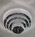 https://cdn.shopify.com/s/files/1/0736/8795/7790/files/oversized-modern-creative-flush-mount-round-multi-layers-crystal-pendant-chandelier-for-livingdining-roomhallway-merlin-lamps-5.webp?v=1765402421
